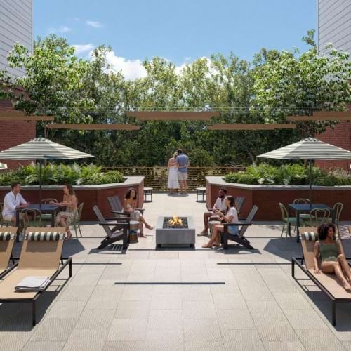 a group of people sitting outside in a courtyard